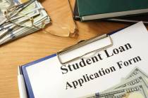 Student loan form with dollars and books.