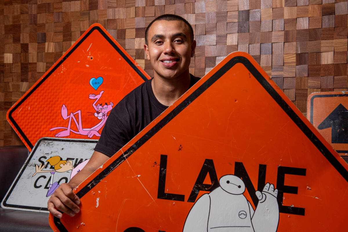 UNLV kicker Daniel Gutierrez poses for a portrait with some of his paintings at the Fertitta Fo ...