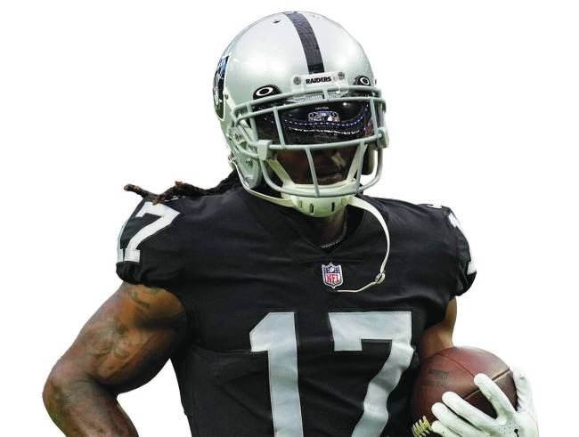 Las Vegas Raiders wide receiver Davante Adams (17) warms up before an NFL preseason football ga ...