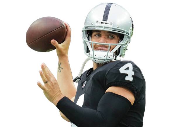 Derek Carr warms up before a preseason game against the New England Patriots, Friday, Aug. 26, ...