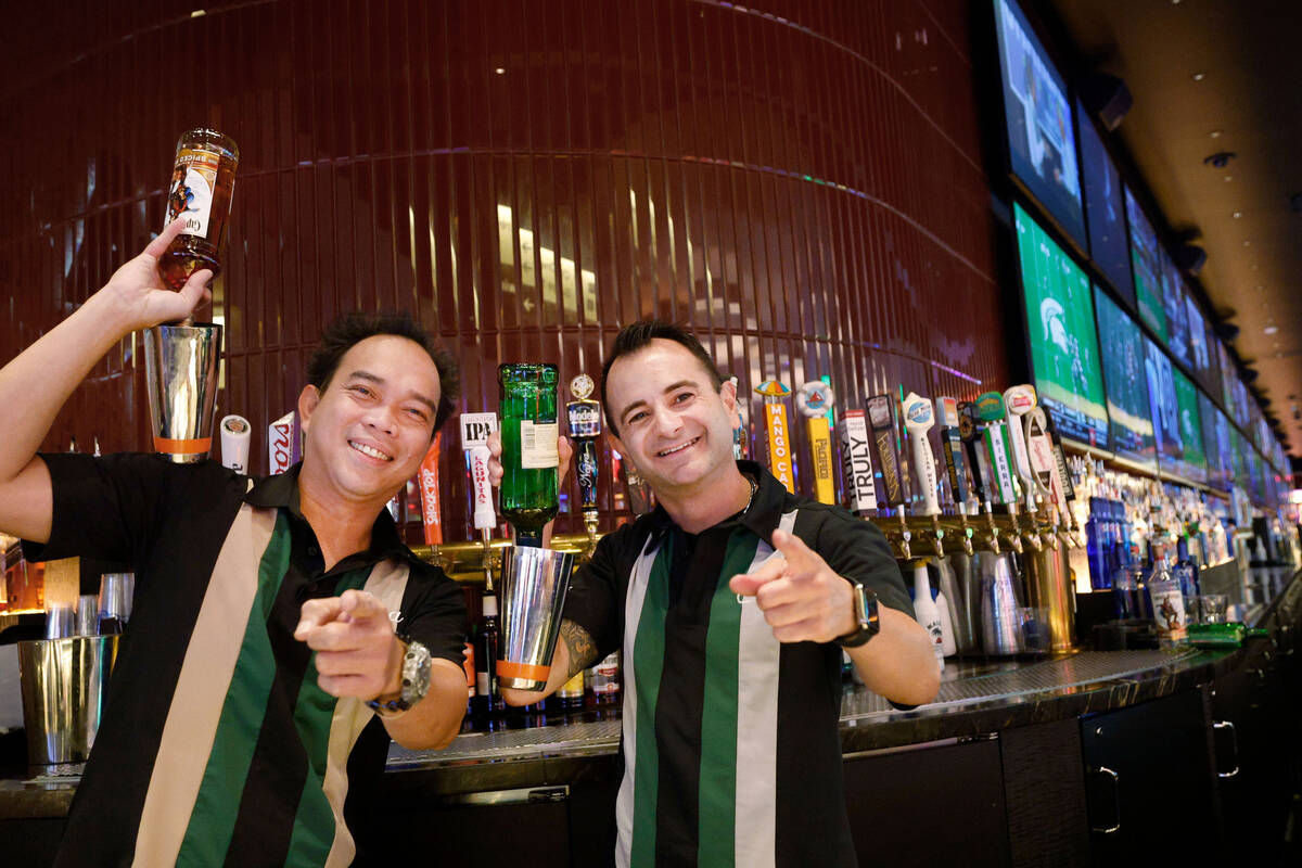 Flair bartenders Spyder Rigor, left, and Vache Manoukian pose for a photo, Friday, Sept. 2, 202 ...