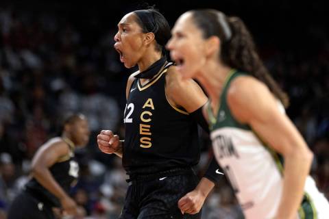 Las Vegas Aces forward A'ja Wilson (22) and Seattle Storm guard Sue Bird (10) react after Wilso ...