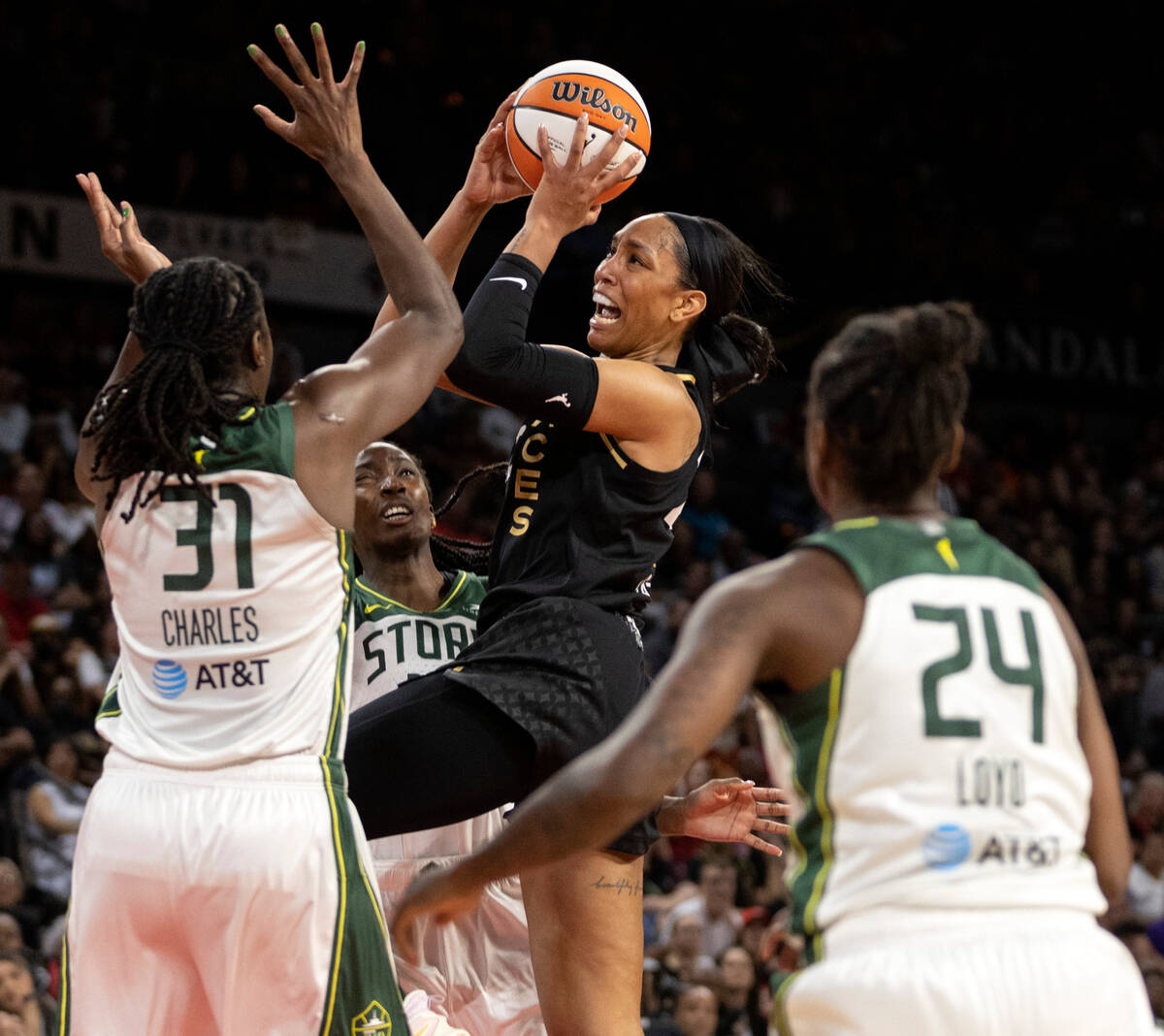 Las Vegas Aces forward A'ja Wilson (22) shoots against Seattle Storm center Tina Charles (31) a ...