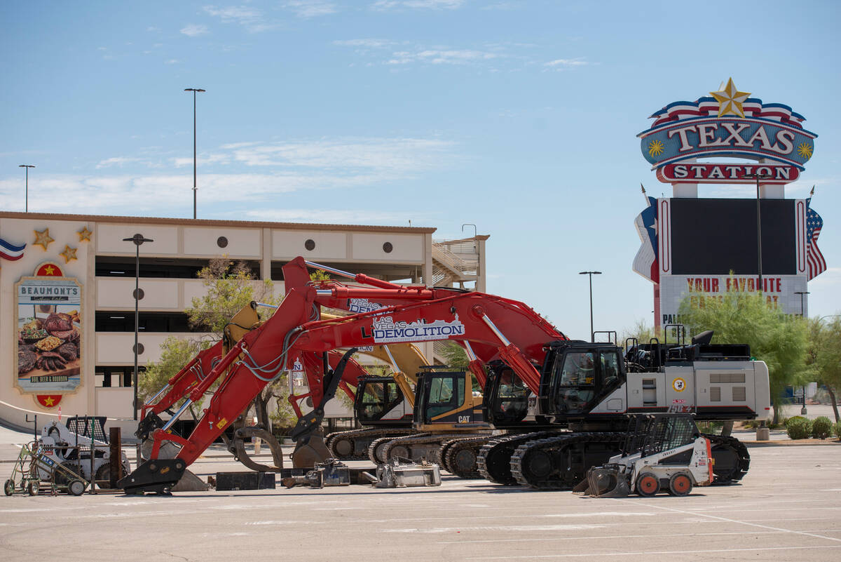 Heavy machinery is staged in the parking lot of the Texas Station hotel-casino at Rancho Drive ...
