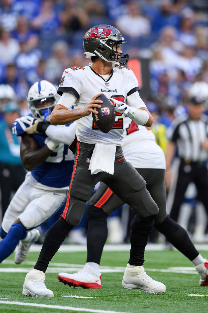 Tampa Bay Buccaneers quarterback Tom Brady (12) looks downfield during an NFL football game aga ...