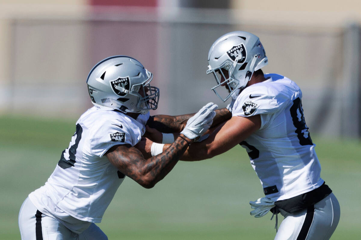 Raiders tight ends Darren Waller (83) and Jesper Horsted (80) compete against each other during ...