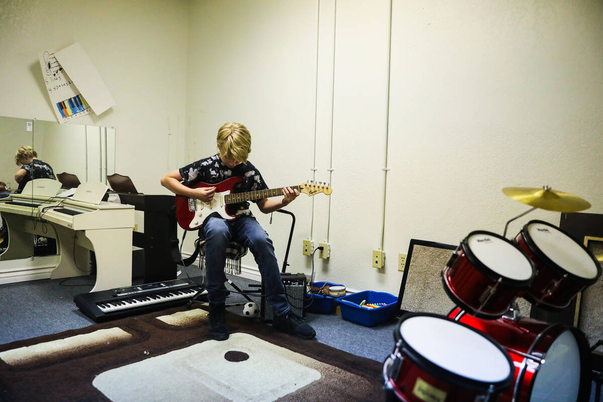 Dan Petit, 12, plays guitar at Bloom Academy in Las Vegas on Aug. 31, 2022. Bloom Academy is a ...