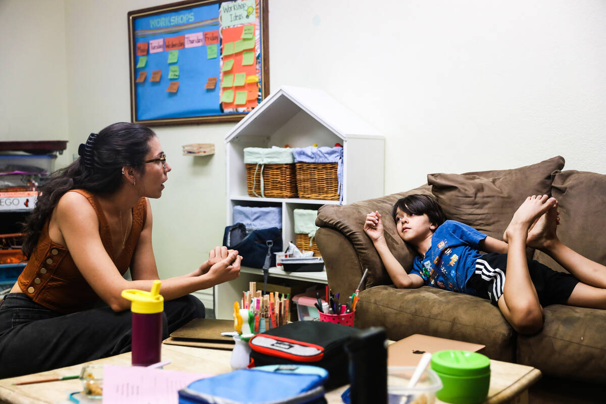 Yamila De Leon speaks with Marley Harris, 8, on Aug. 31, 2022, at Bloom Academy, a "self-direct ...