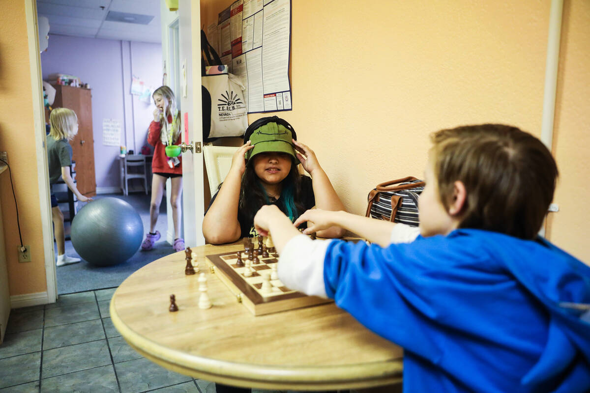 Izzy Delon, 10, left, plays chess with Calvin Campbell, 11, right, at Bloom Academy in Las Vega ...