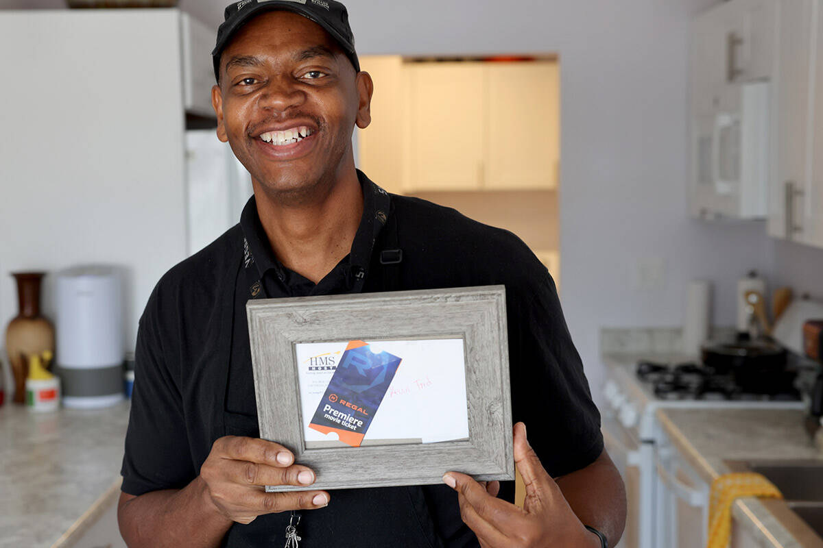 Kevin Ford shows a gift from his employer at his Las Vegas home Thursday, Sept. 1, 2022. The Bu ...
