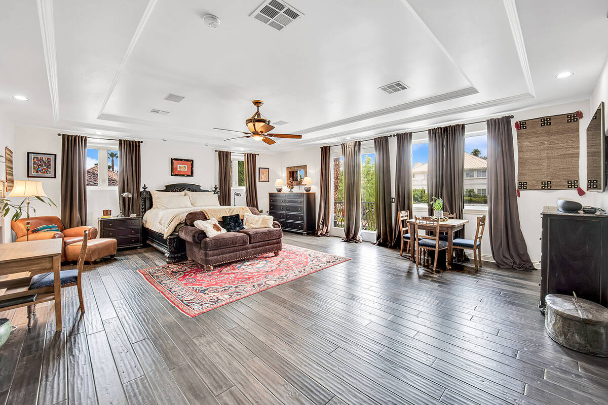 The upstairs primary bedroom features a huge walk-in closet and remodeled bathroom with a steam ...