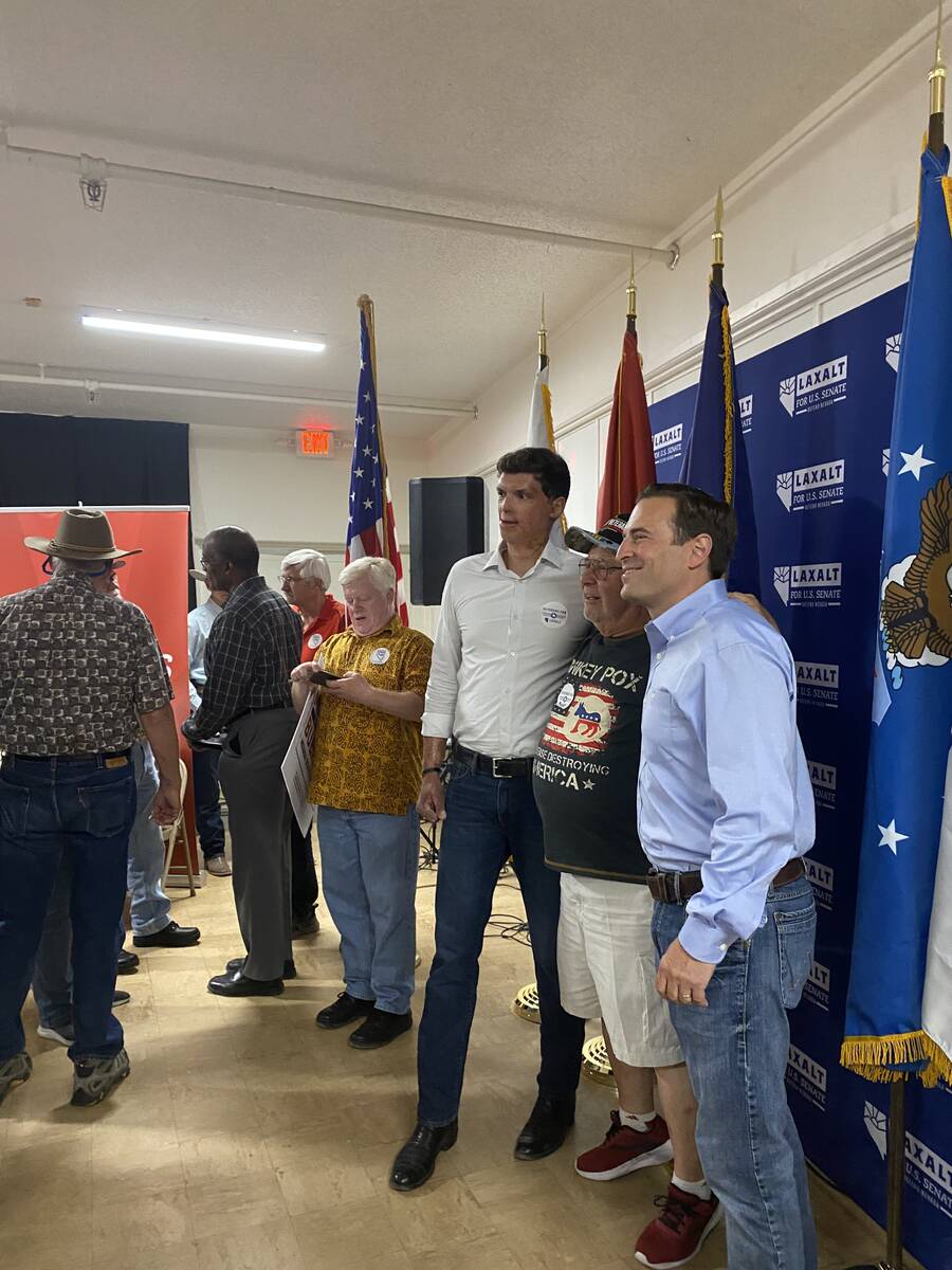 Republican U.S. Senate candidate Adam Laxalt and Sam Brown pose with an attendee of a veterans' ...