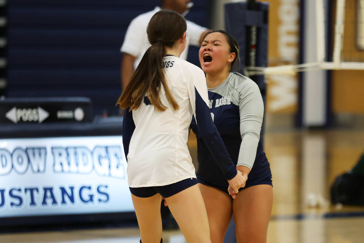 Shadow Ridge Elaina Smith (3) and Aivry Makaiwi (2) react after a play during a girl's volleyba ...