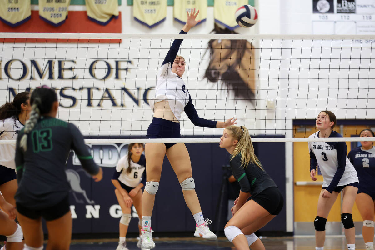 Shadow Ridge's Lexi Luszeck (9) spikes the ball for a point against Palo Verse during a girl's ...