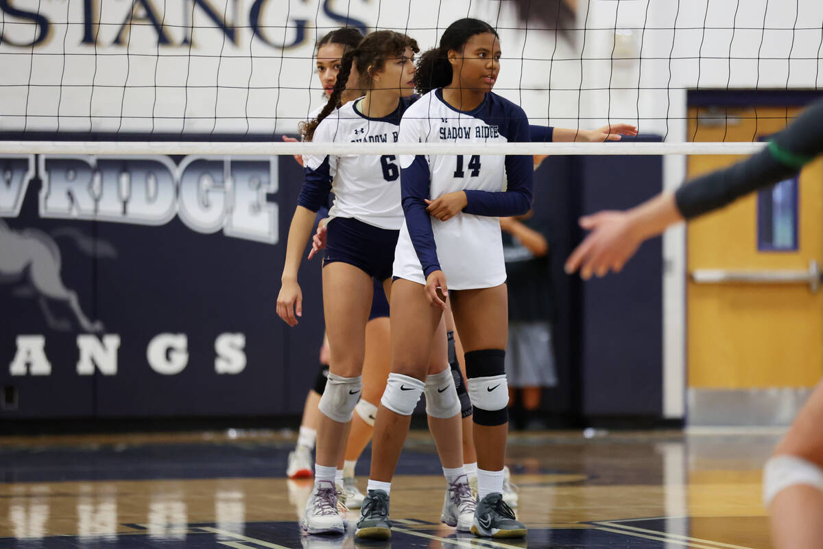 Shadow Ridge players get ready to receive a serve from Palo Verse during a girl's volleyball ga ...