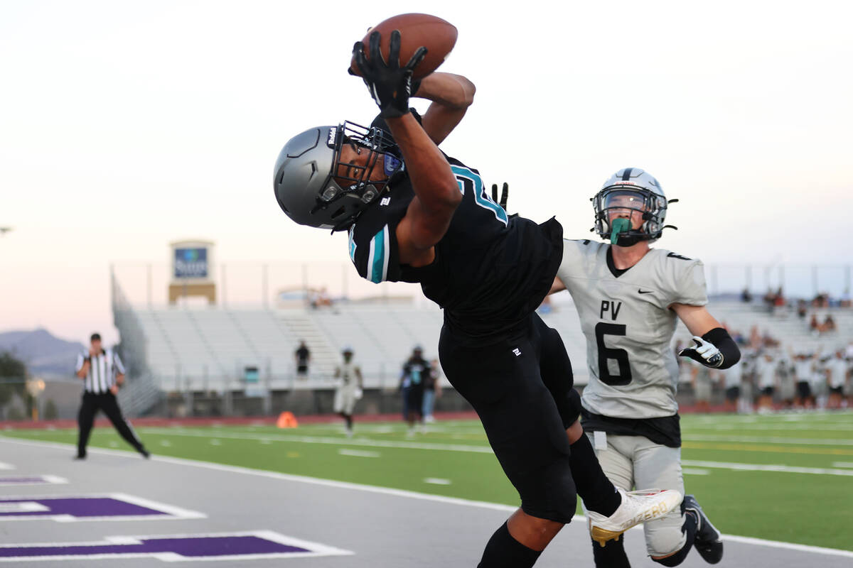 Silverado's Donavyn Pellot (2) makes a touchdown catch as Palo Verde's Marcus Thielke (6) looks ...