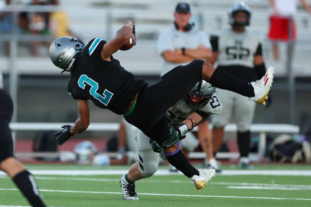 Silverado's Donavyn Pellot (2) is tackled by Palo Verde's Blair Thayer (23) during the first ha ...