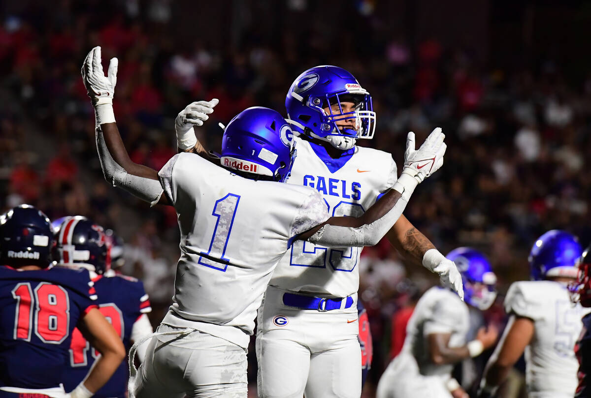 Bishop Gorman wide receiver Trech Kekahuna (23) and w ide receiver Zachariah Branch (1) celebra ...