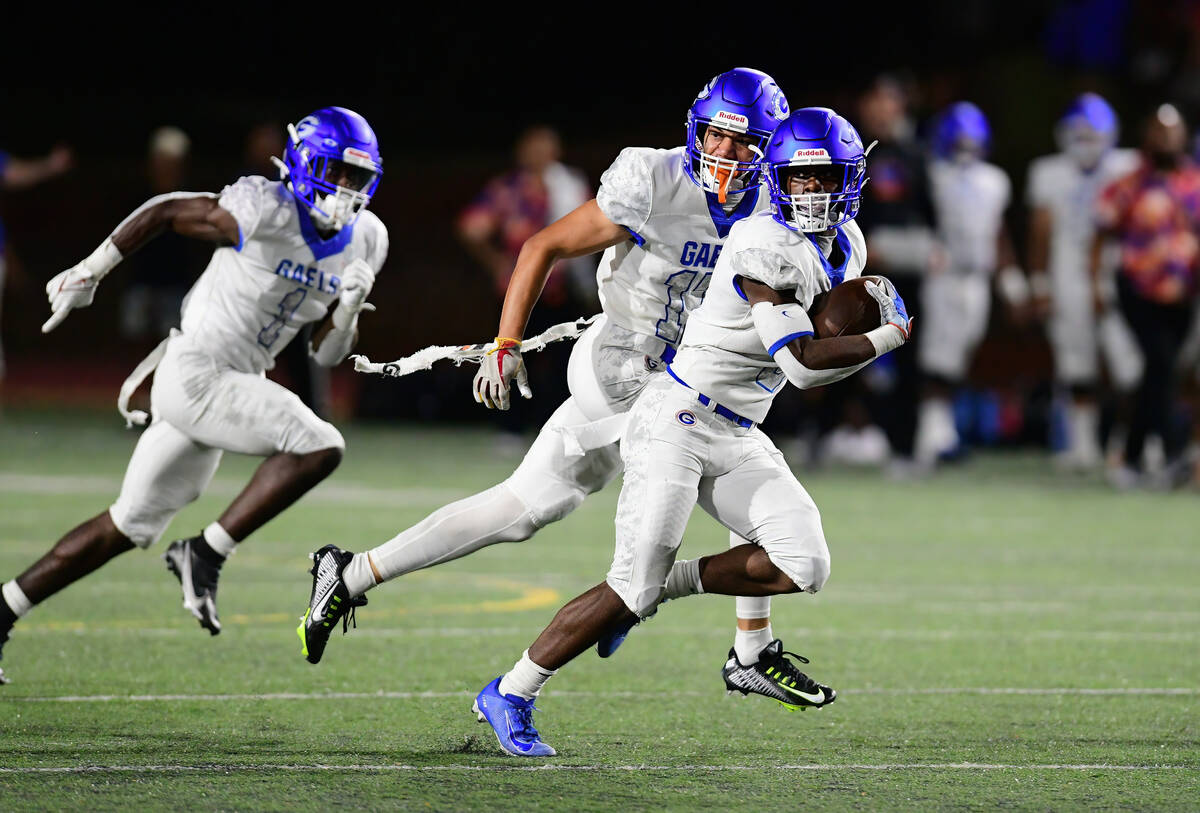 Bishop Gorman wide receiver Zachariah Branch (1) looked back as he raced for a touchdown during ...