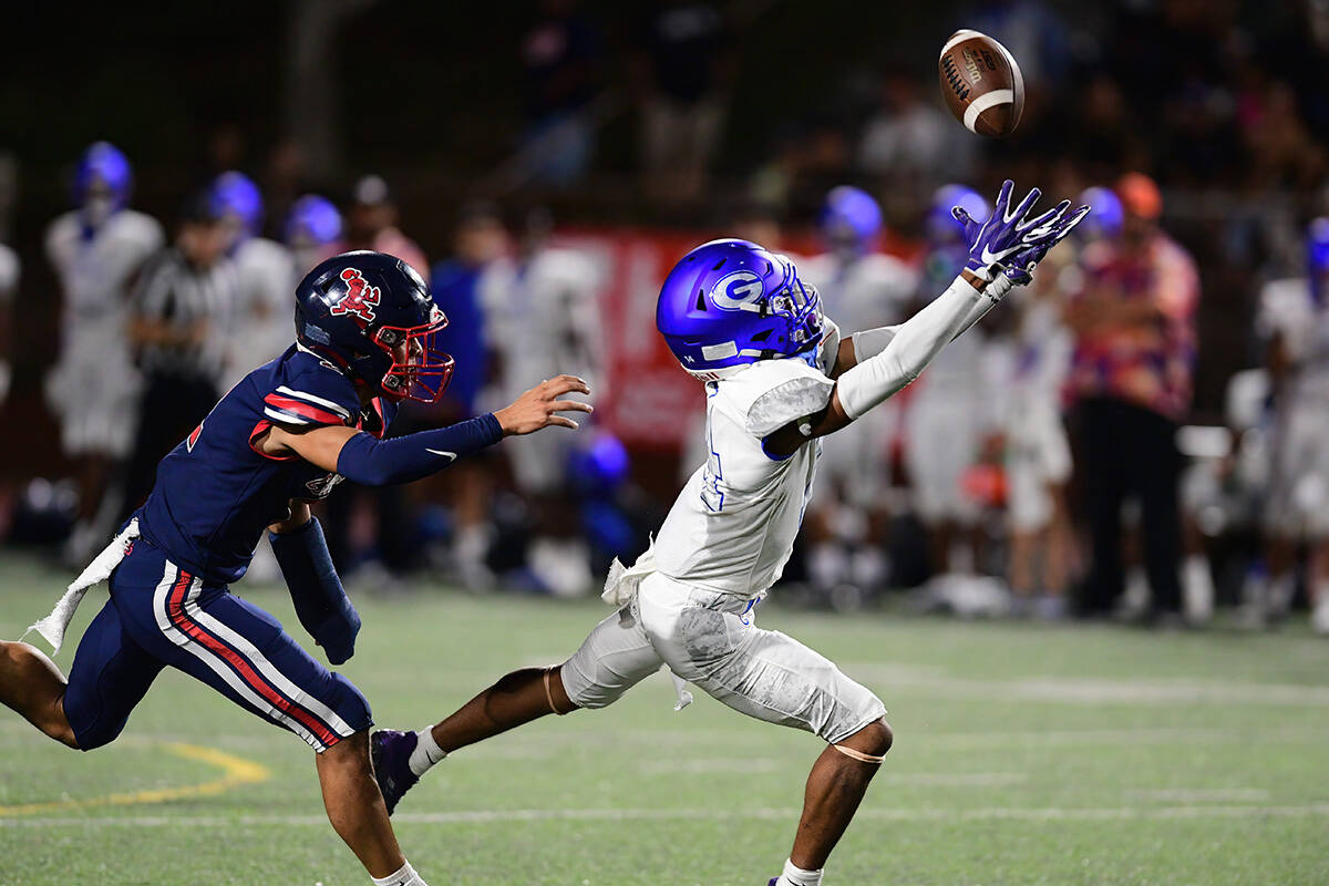 Bishop Gorman wide receiver Jaylon Edmond (14) brought down the ball during a game between the ...