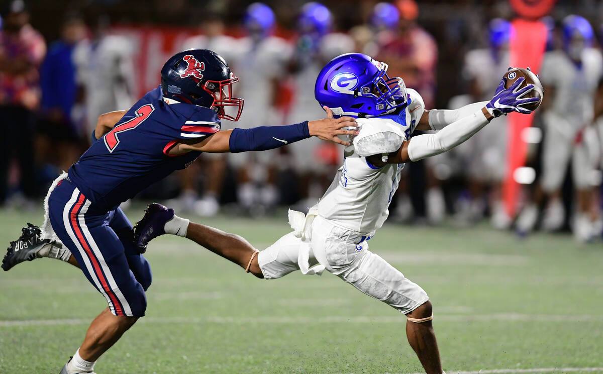 Bishop Gorman wide receiver Jaylon Edmond (14) brought down the ball during a game between the ...