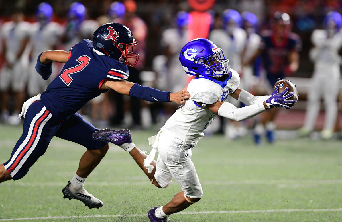 Bishop Gorman wide receiver Jaylon Edmond (14) brought down the ball during a game between the ...