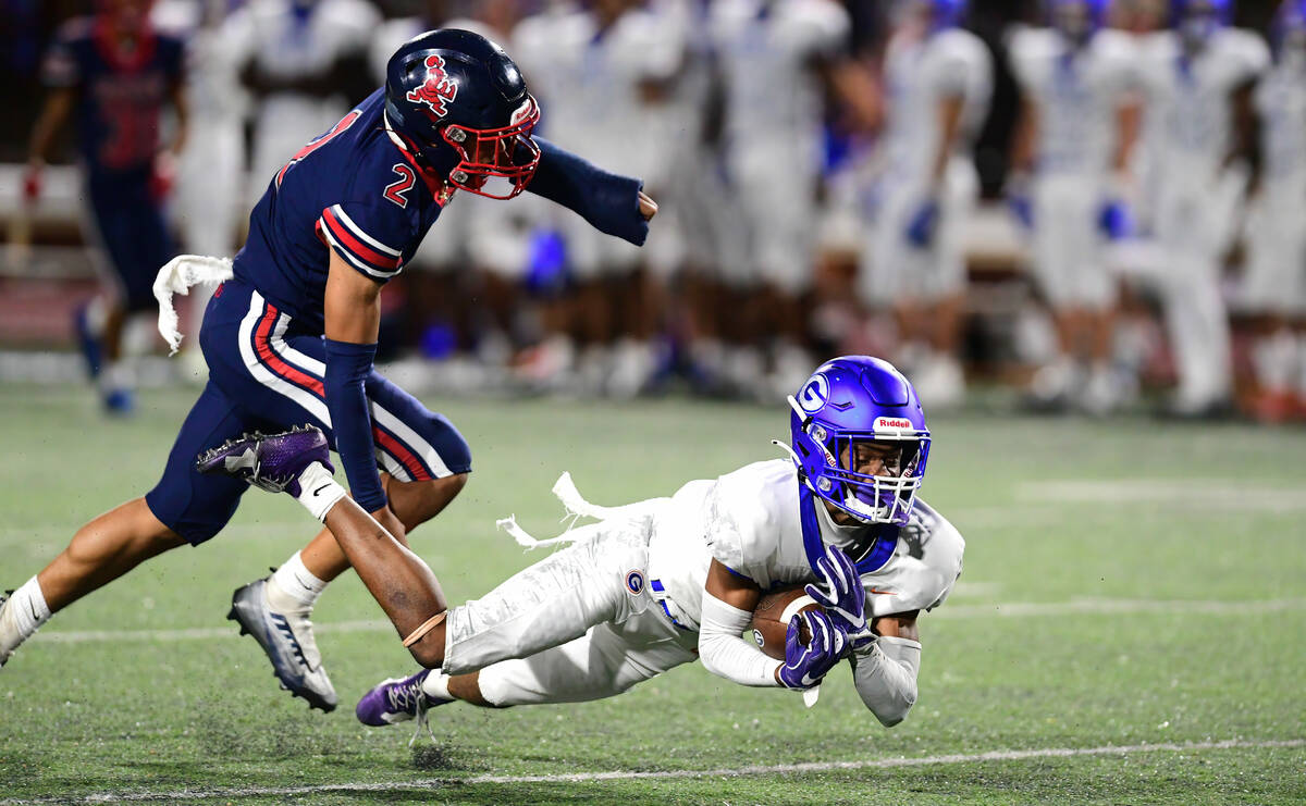 Bishop Gorman wide receiver Jaylon Edmond (14) brought down the ball during a game between the ...