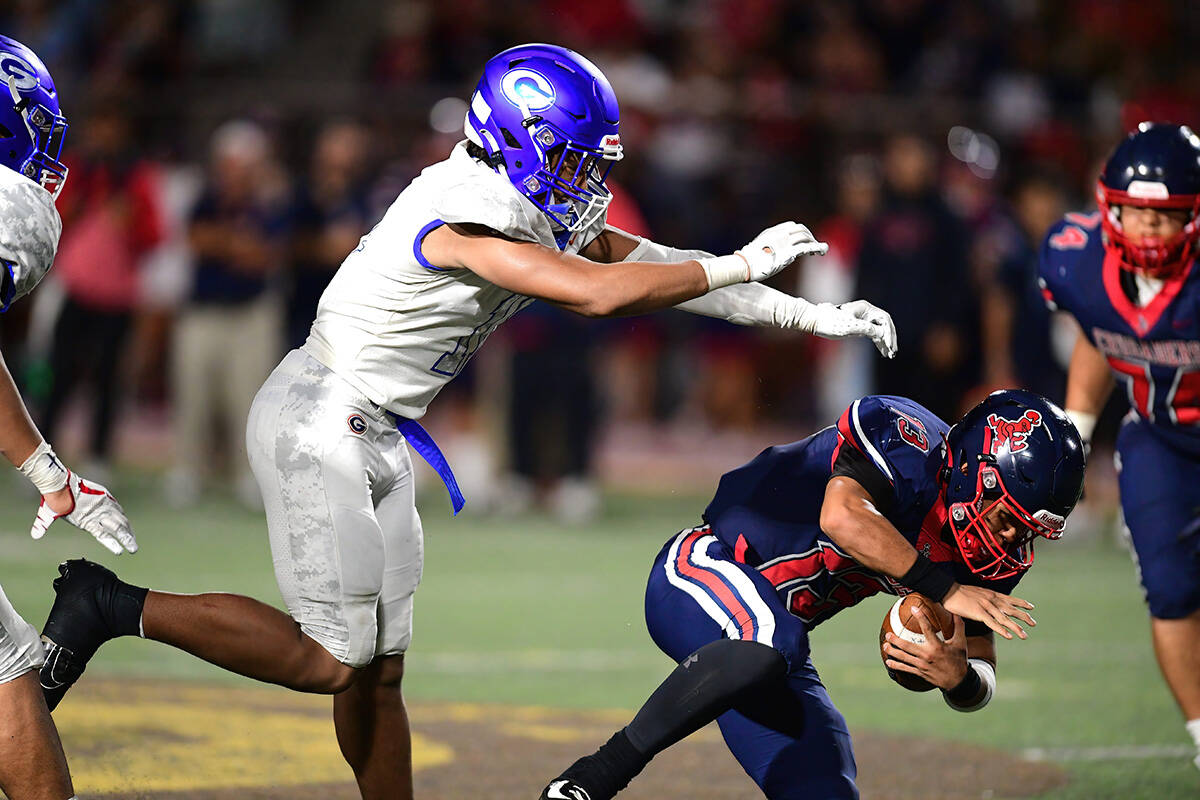 Bishop Gorman linebacker Quincy Davis (11) sacked the quarterback during a game between the Bis ...