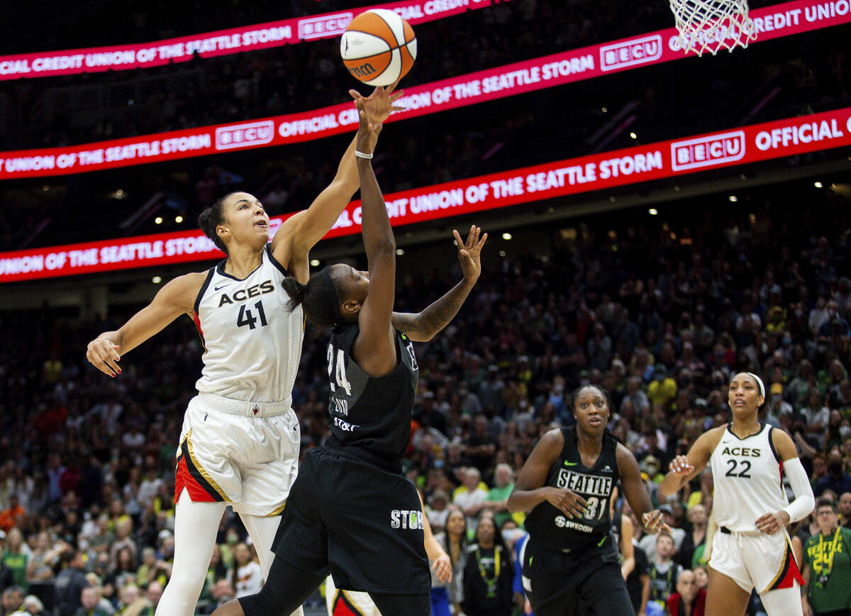 Las Vegas Aces center Kiah Stokes (41) defends against Seattle Storm guard Jewell Loyd (24) dur ...
