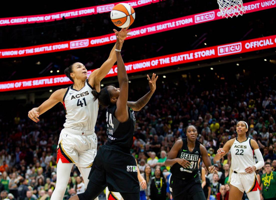 Las Vegas Aces center Kiah Stokes (41) defends against Seattle Storm guard Jewell Loyd (24) dur ...