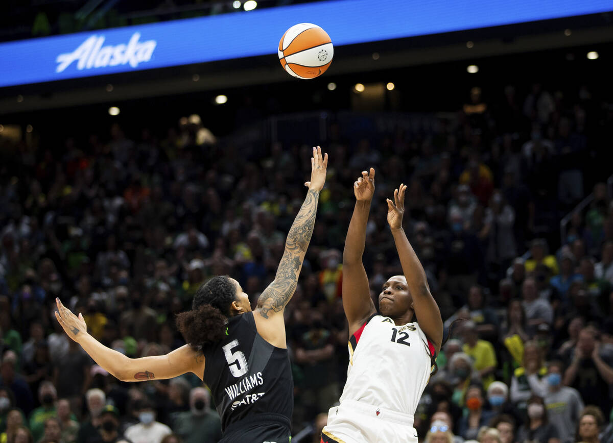 Las Vegas Aces guard Chelsea Gray (12) shoots over Seattle Storm forward Gabby Williams (5) dur ...