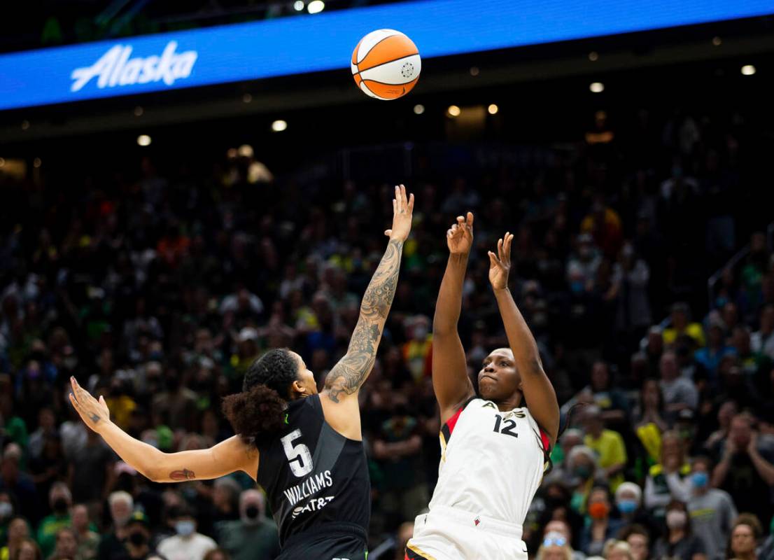 Las Vegas Aces guard Chelsea Gray (12) shoots over Seattle Storm forward Gabby Williams (5) dur ...