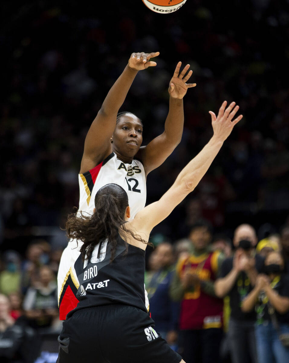 Las Vegas Aces guard Chelsea Gray (12) passes over the defense of Seattle Storm guard Sue Bird ...