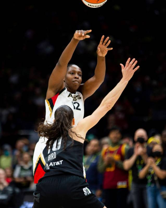 Las Vegas Aces guard Chelsea Gray (12) passes over the defense of Seattle Storm guard Sue Bird ...