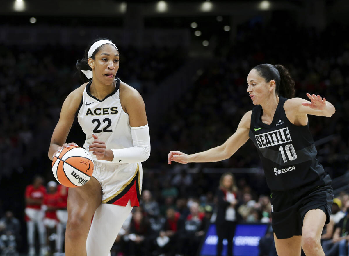 Las Vegas Aces forward A'ja Wilson (22) drives against Seattle Storm guard Sue Bird (10) during ...