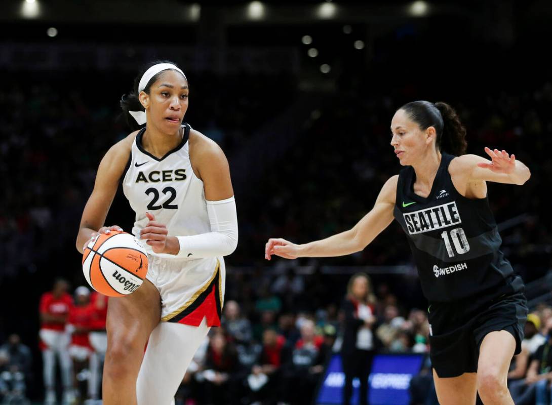 Las Vegas Aces forward A'ja Wilson (22) drives against Seattle Storm guard Sue Bird (10) during ...