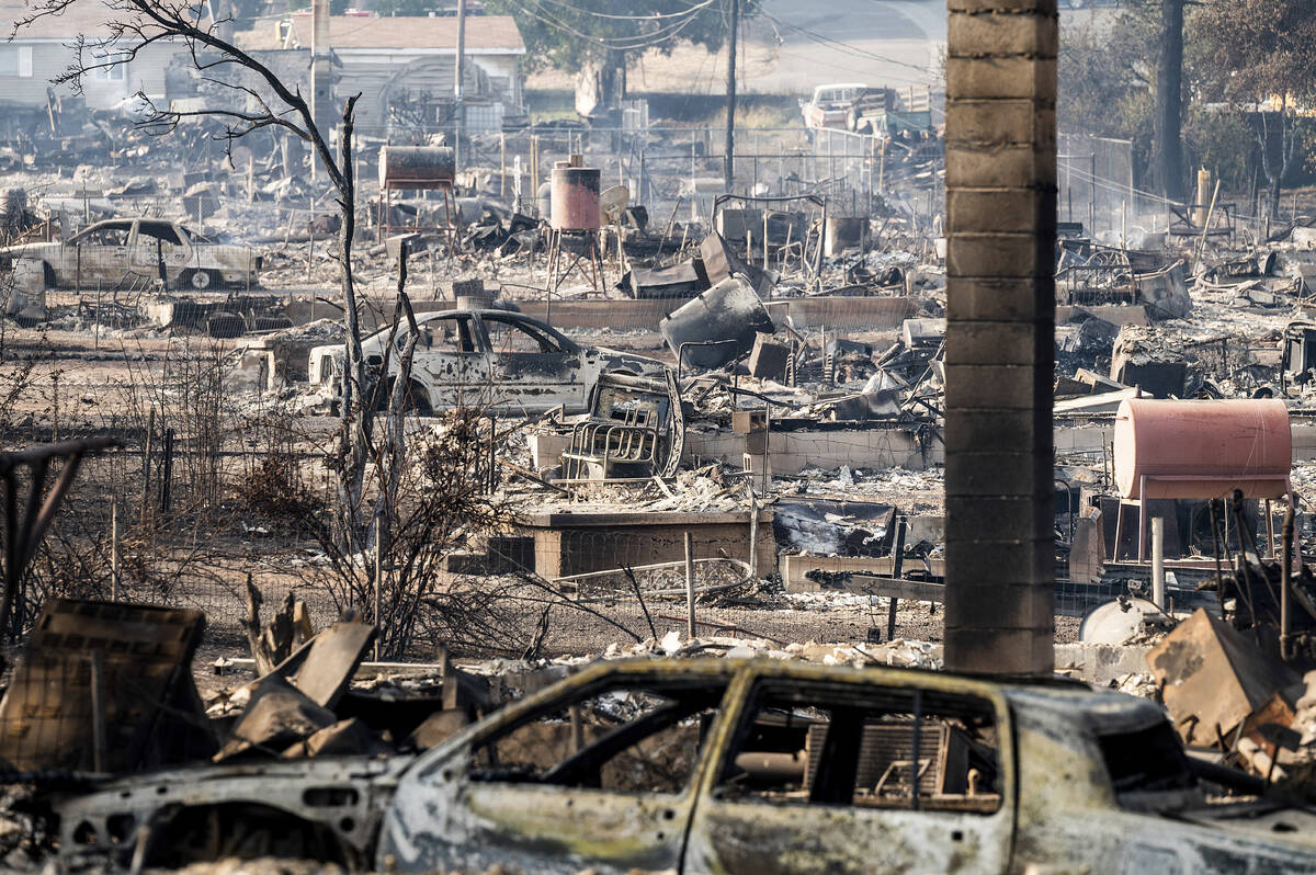 Homes and vehicle destroyed by the Mill Fire line Wakefield Avenue on Saturday, Sept. 3, 2022, ...
