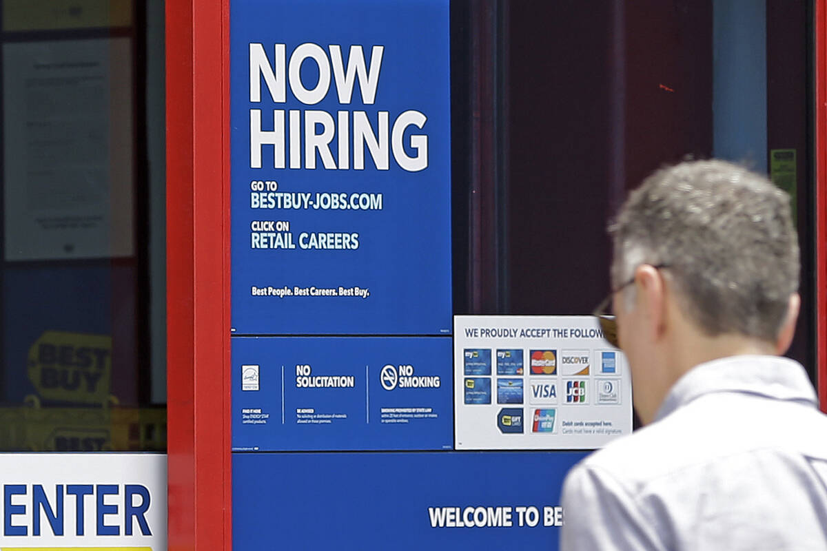 In this Monday, May 22, 2017, photo, a "Now Hiring" sign welcomes a customer entering a Best Bu ...