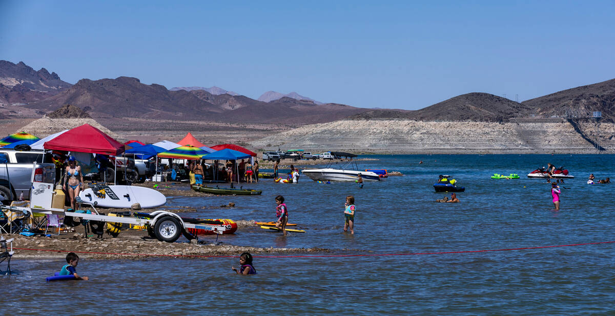 Visitors take to the shoreline about Boulder Beach on Labor Day within the Lake Mead National R ...