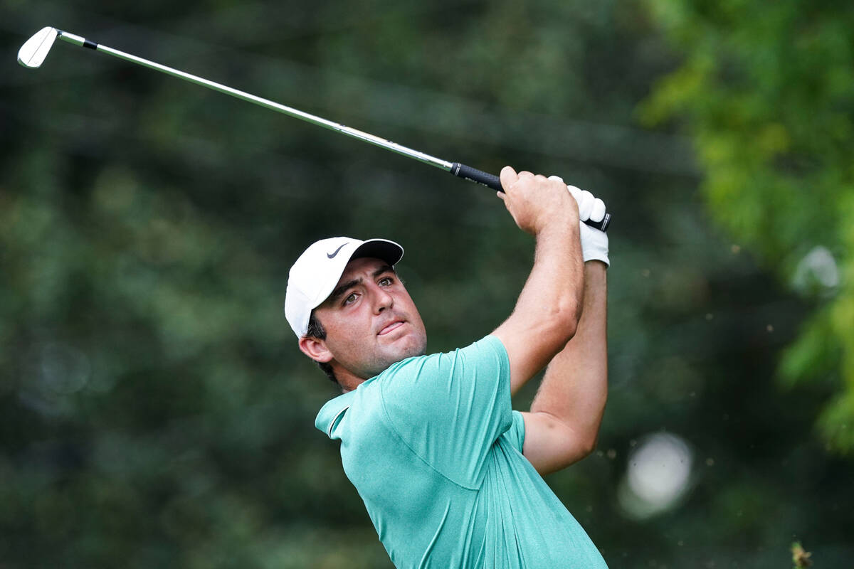 Scottie Scheffler hits from the second tee during the final round of the Tour Championship golf ...