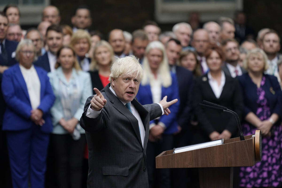Outgoing British Prime Minister Boris Johnson speaks outside Downing Street in London, Tuesday, ...