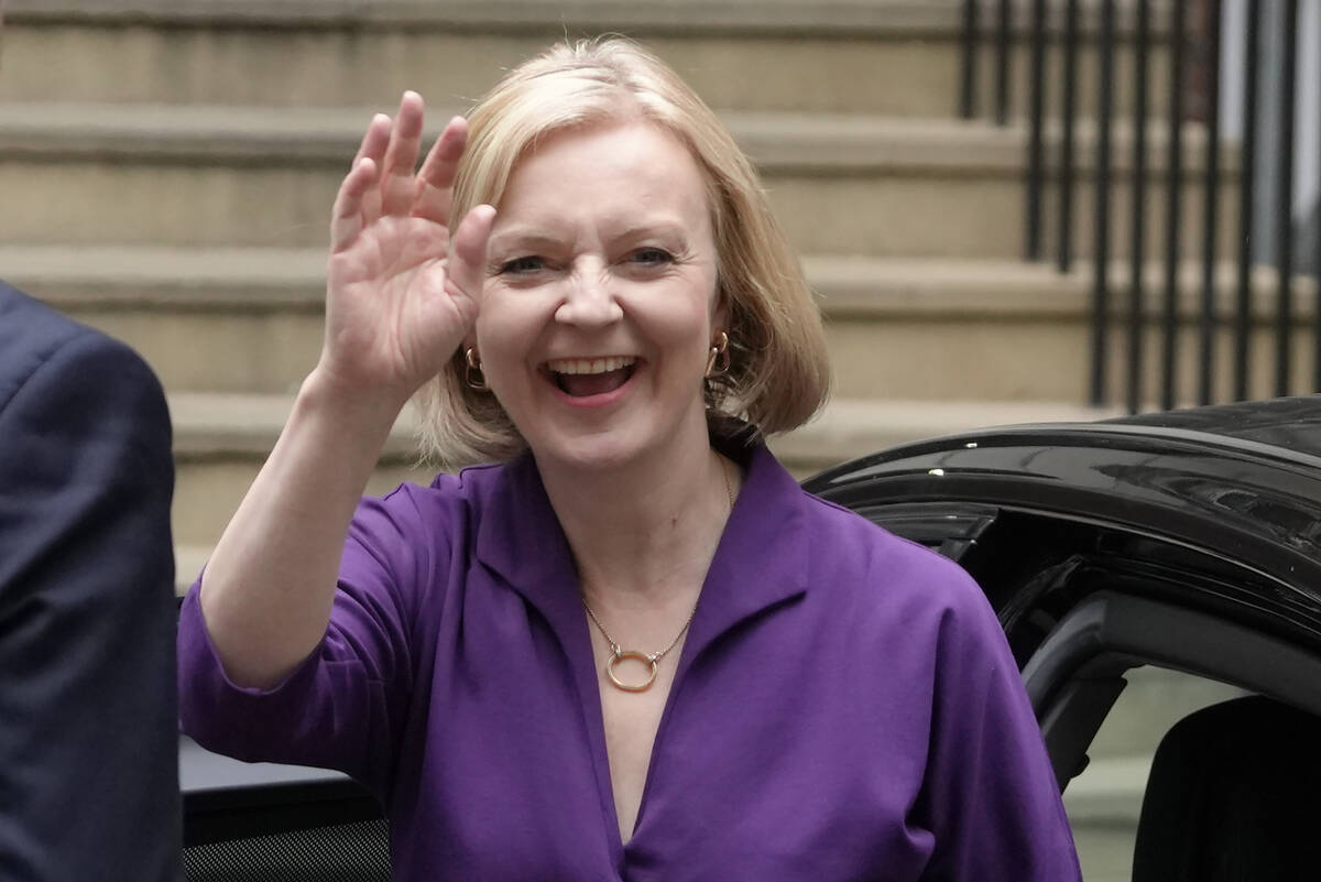 FILE - Liz Truss arrives at Conservative Central Office in Westminster after winning the Conser ...