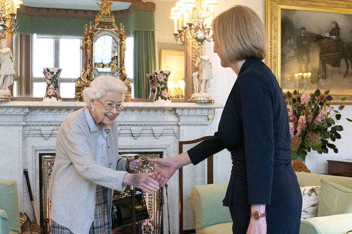 Britain's Queen Elizabeth II, left, welcomes Liz Truss during an audience at Balmoral, Scotland ...