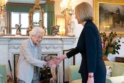 Britain's Queen Elizabeth II, left, welcomes Liz Truss during an audience at Balmoral, Scotland ...
