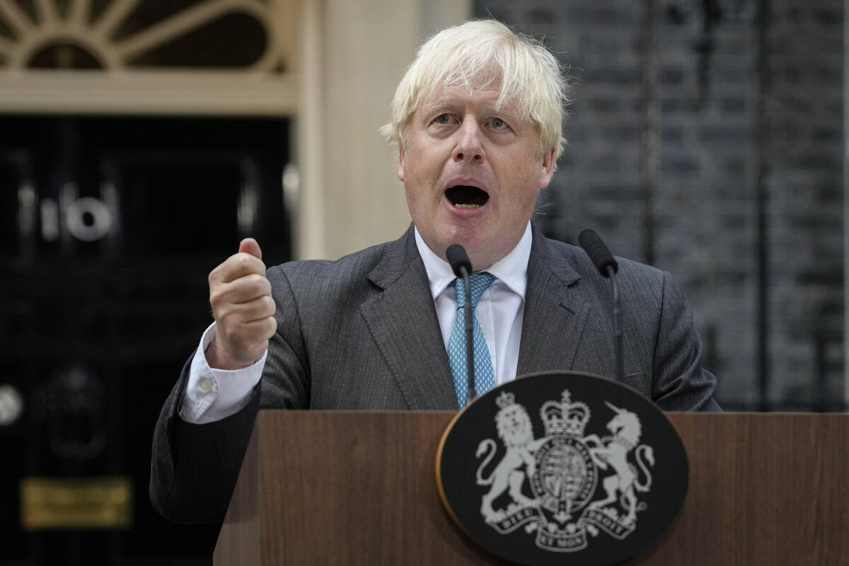 Outgoing British Prime Minister Boris Johnson speaks outside Downing Street in London, Tuesday, ...