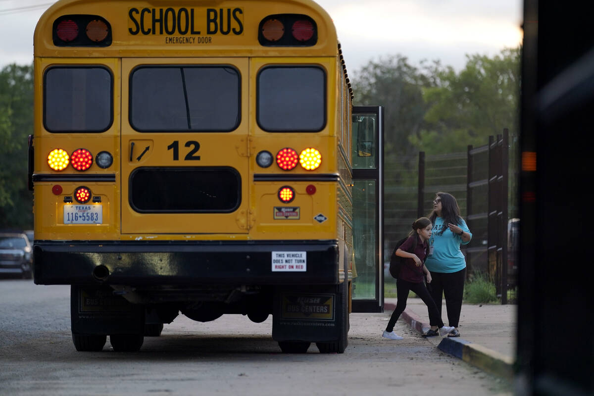 Students arrive at Uvalde Elementary for the first day of school as workers continue constructi ...