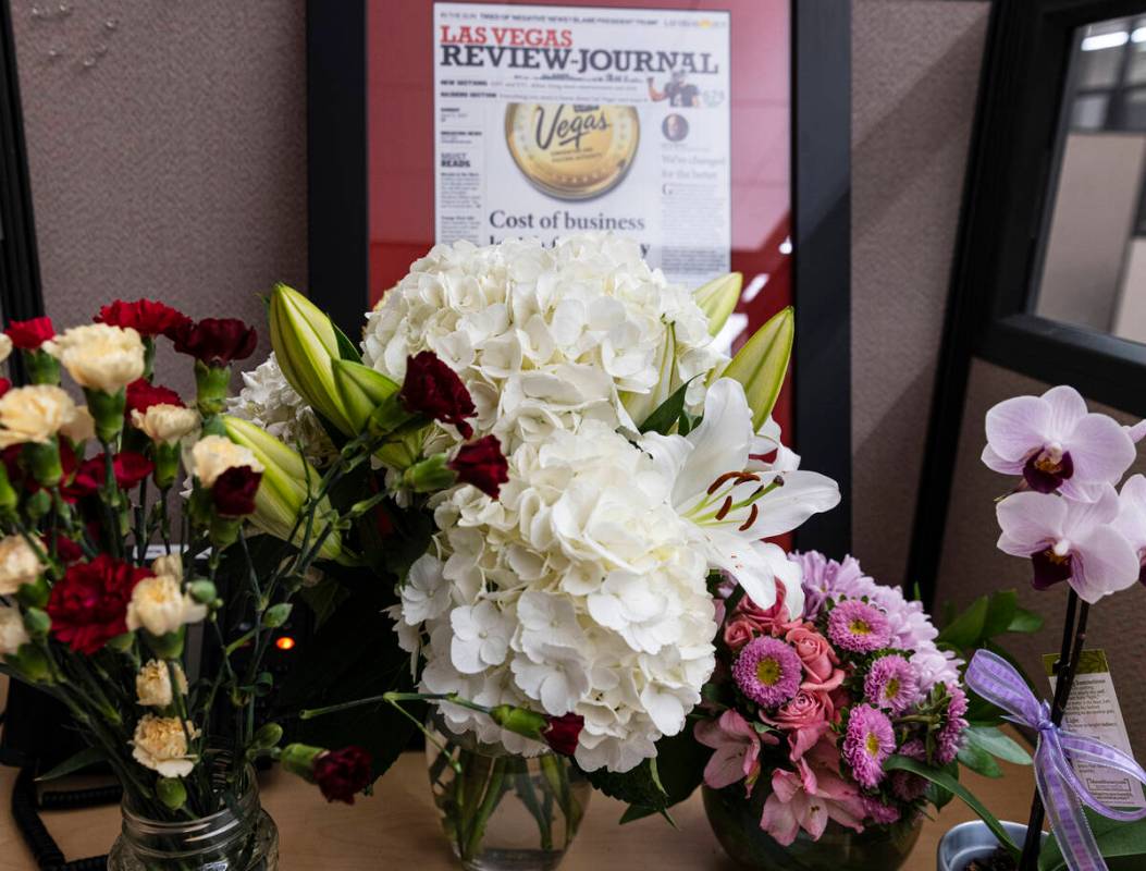 Flowers are placed on the desk of Jeff German, a Review-Journal investigative reporter, on Tues ...