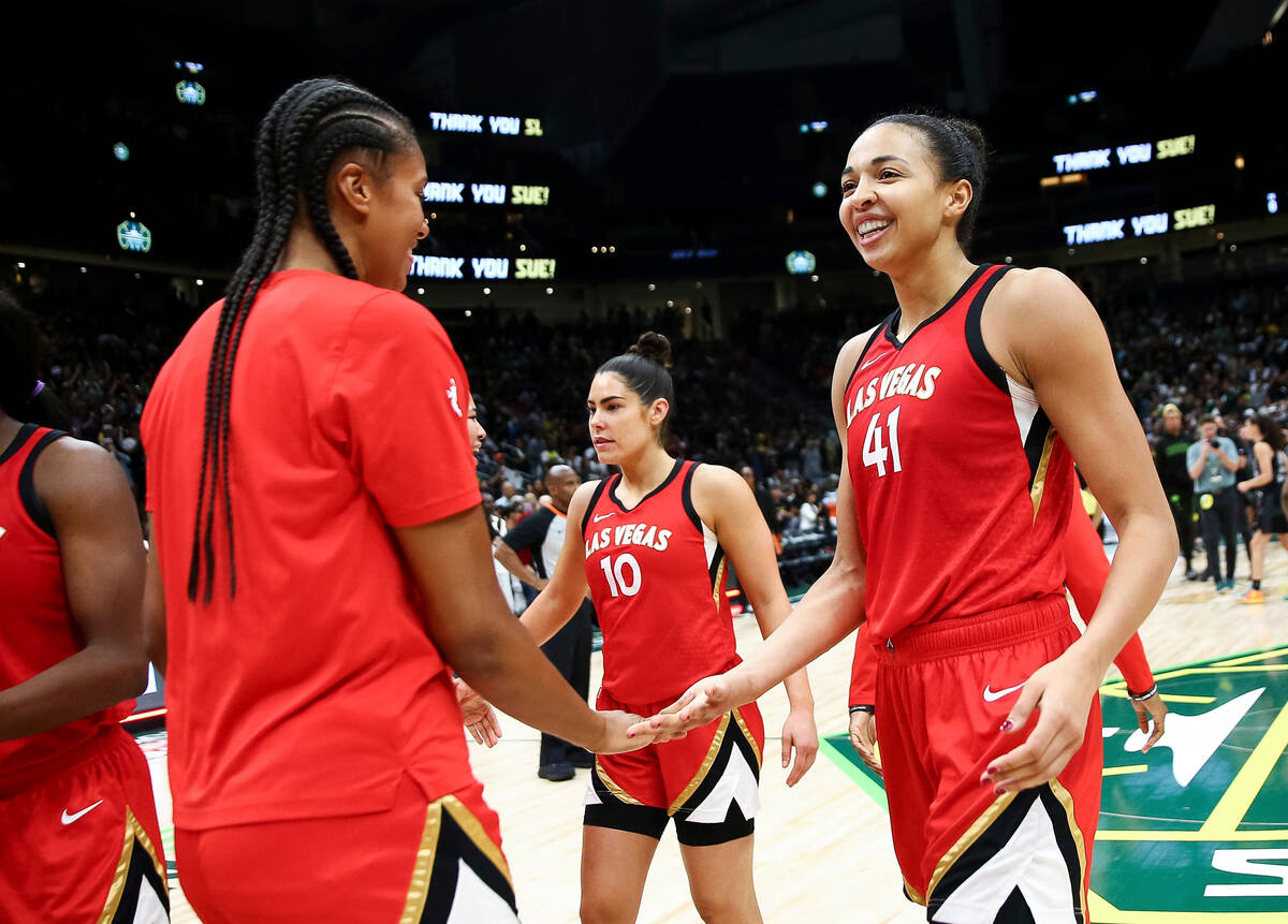 Las Vegas Aces center Kiah Stokes (41) greets center Iliana Rupert, left, after the Aces defeat ...
