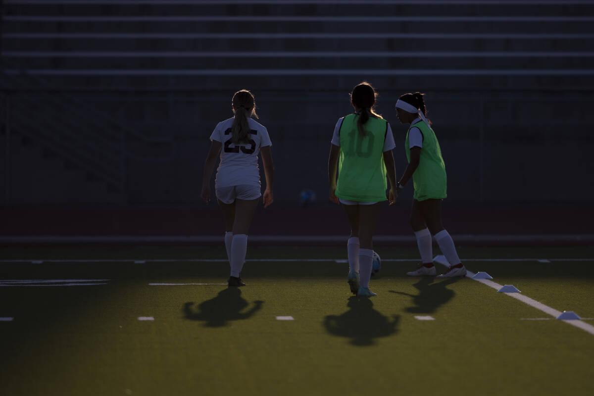The Desert Oasis varsity girls soccer team warms up before their game at Centennial High School ...