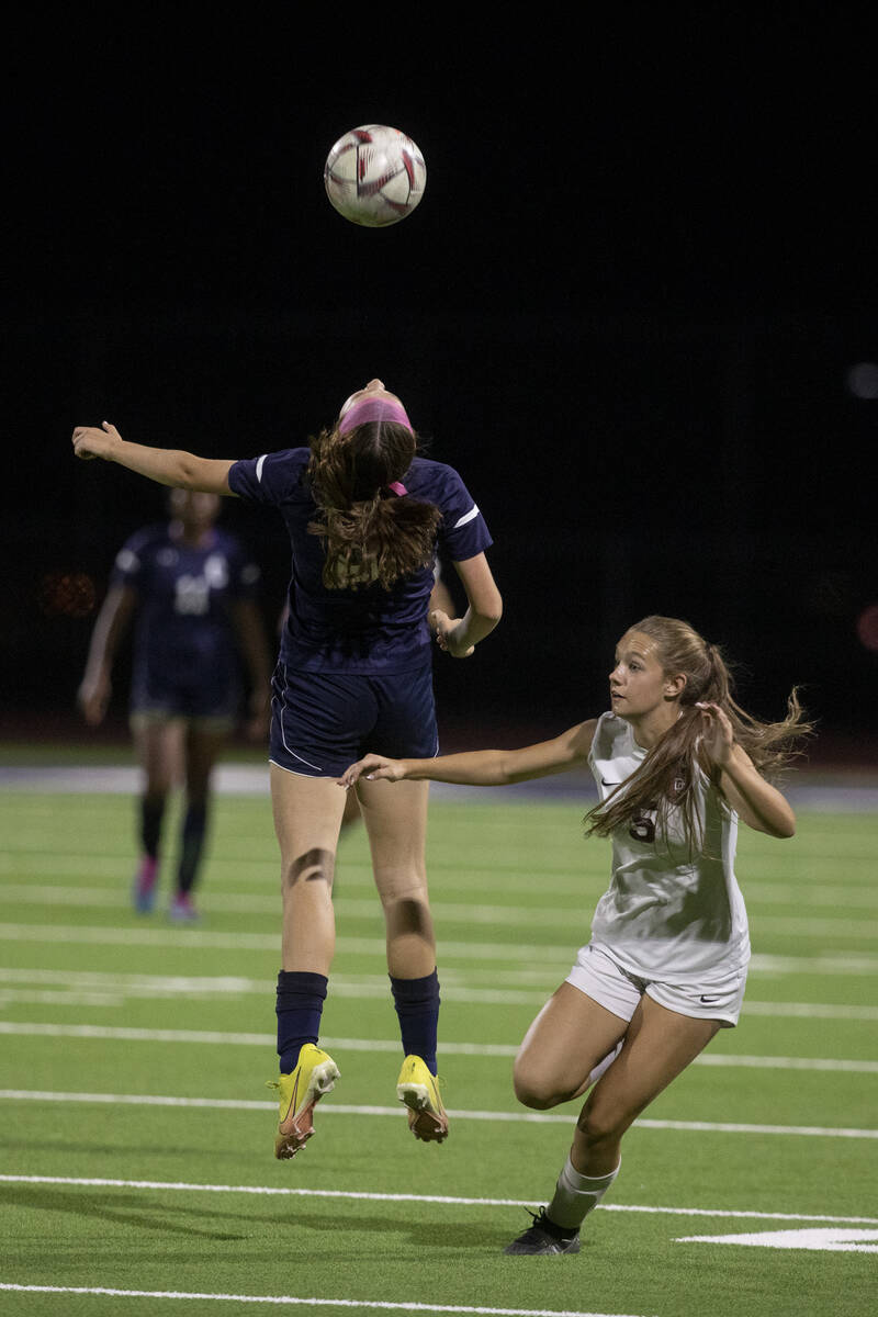 Centennial High School freshman Claire Orme (8) goes up for a header against Desert Oasis junio ...